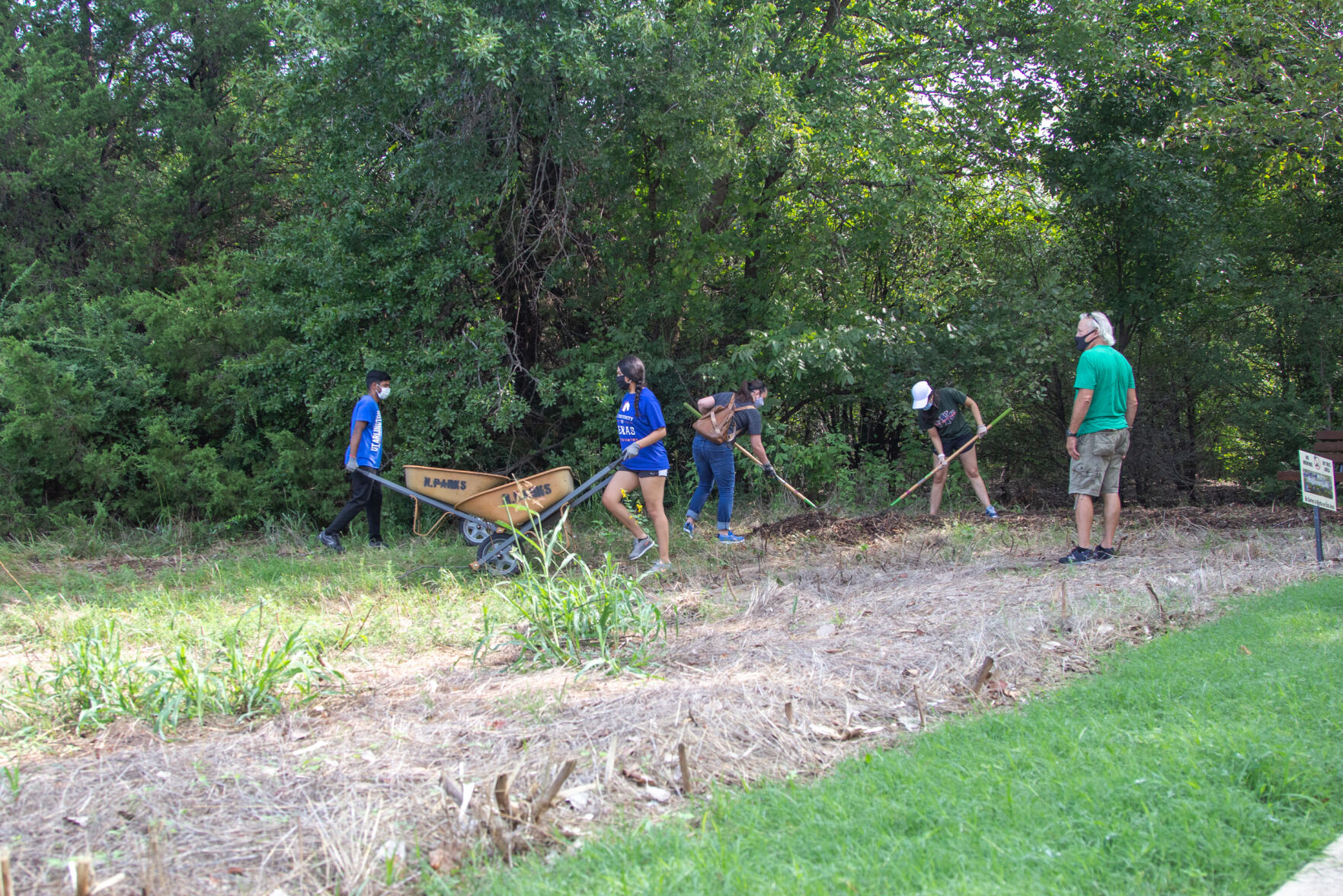 Photos: Volunteers improve trails at O.S. Gray Natural Area for Super Service Saturday